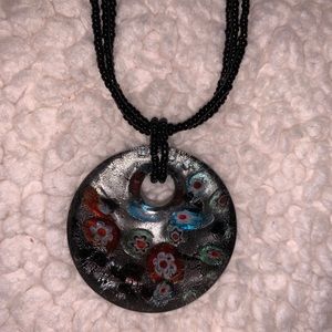 Black necklace with deep floral accents